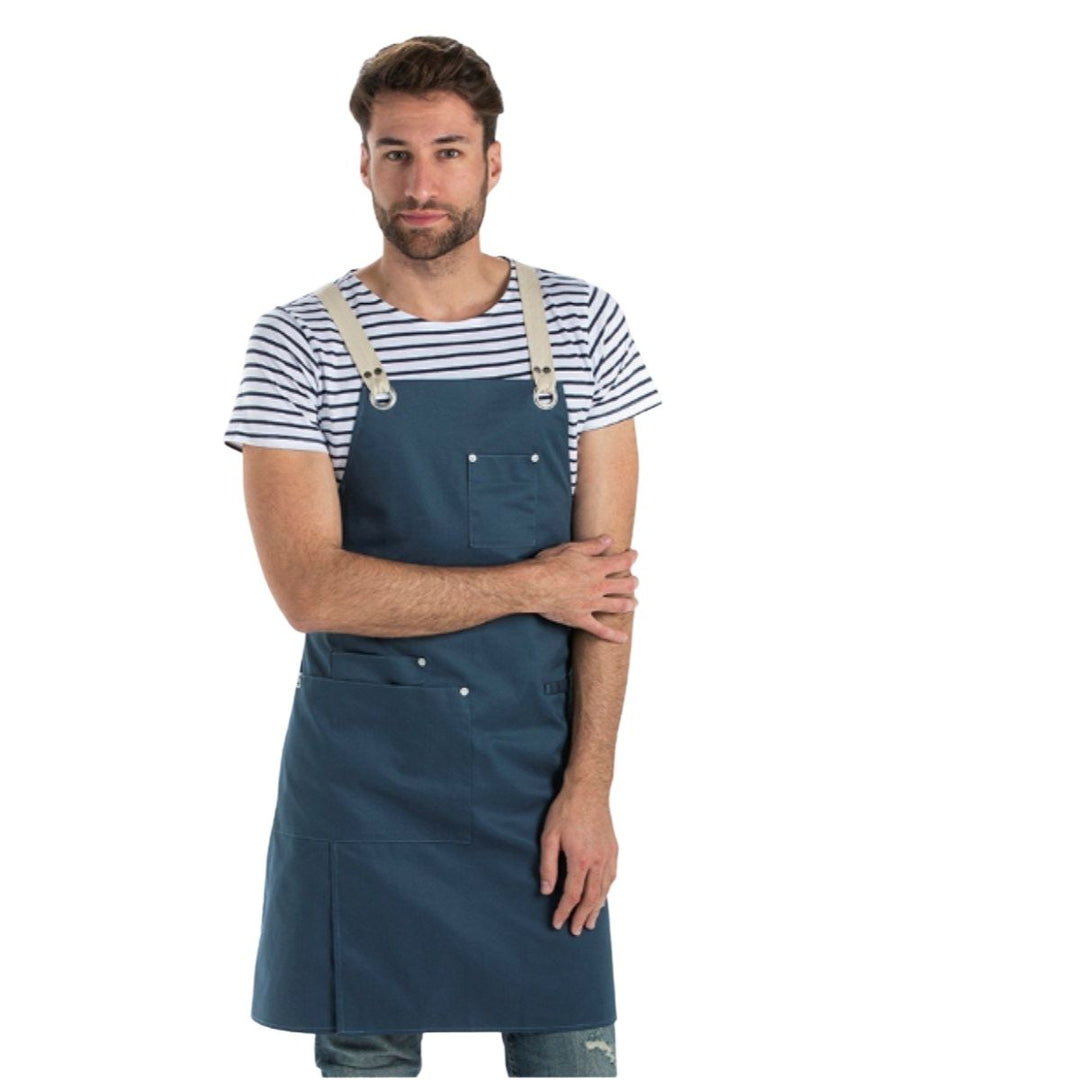 Unisex petrol blue bib apron with reinforced pockets for the hotel and catering industry